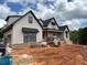 New two-story home with dark roof and white siding under construction at 1089 Mount Carmel Church Ln, Canton, GA 30114