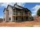 Rear exterior of home with covered porch and deck under construction at 1089 Mount Carmel Church Ln, Canton, GA 30114