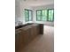 Open kitchen layout featuring an island and large windows offering abundant natural light at 1089 Mount Carmel Church Ln, Canton, GA 30114