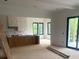Spacious living room with an unfinished kitchen and large windows at 1089 Mount Carmel Church Ln, Canton, GA 30114