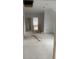 Spacious unfinished living room with plenty of natural light, awaiting personalization and design at 1089 Mount Carmel Church Ln, Canton, GA 30114