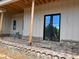 Brick patio under construction with covered porch and wood beams at 1089 Mount Carmel Church Ln, Canton, GA 30114
