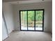 Bright room with large sliding glass doors and a serene view at 1089 Mount Carmel Church Ln, Canton, GA 30114