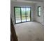 Sunny room with sliding glass doors framing a beautiful outdoor view, offering an indoor-outdoor lifestyle at 1089 Mount Carmel Church Ln, Canton, GA 30114