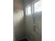Modern shower featuring elegant tile work, built-in niches, and abundant natural light, creating a spa-like retreat at 1089 Mount Carmel Church Ln, Canton, GA 30114