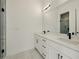 Modern bathroom featuring double vanity with quartz countertops and black fixtures at 2150 Tidwell Ln # 5, Atlanta, GA 30318