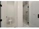 Bathroom featuring enclosed water closet and glass shower with white marble tile at 2150 Tidwell Ln # 5, Atlanta, GA 30318