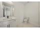 Bathroom with modern white vanity, black hardware, and tiled floor at 2150 Tidwell Ln # 5, Atlanta, GA 30318