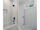 Bright bathroom with white subway tile, black fixtures, and marble floor at 2150 Tidwell Ln # 5, Atlanta, GA 30318