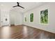 Bedroom with wood floors and multiple windows providing ample natural light and outdoor views at 2150 Tidwell Ln # 5, Atlanta, GA 30318