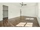 Large bedroom featuring hardwood floors, ceiling fan, and ample natural light at 2150 Tidwell Ln # 5, Atlanta, GA 30318