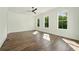Spacious bedroom with hardwood floors, ceiling fan, and ample natural light at 2150 Tidwell Ln # 5, Atlanta, GA 30318