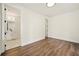 Bedroom with hardwood floors and an open doorway leading to an ensuite bathroom at 2150 Tidwell Ln # 5, Atlanta, GA 30318
