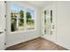 Bright entryway featuring hardwood floors, a modern glass paneled door, and large windows at 2150 Tidwell Ln # 5, Atlanta, GA 30318