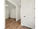 Hallway showcasing hardwood floors, white trim, and doors leading to other rooms at 2150 Tidwell Ln # 5, Atlanta, GA 30318