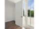 Hallway with hardwood floors leading to outdoor terrace with french doors at 2150 Tidwell Ln # 5, Atlanta, GA 30318