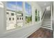 Bright hallway featuring large windows and staircase with new hardwood floors at 2150 Tidwell Ln # 5, Atlanta, GA 30318