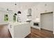 Well-lit kitchen with white cabinets, quartz countertops, a kitchen island and stainless steel appliances at 2150 Tidwell Ln # 5, Atlanta, GA 30318