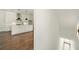 View from stairway of the kitchen with white cabinets and a center island at 2150 Tidwell Ln # 5, Atlanta, GA 30318