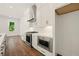 Modern kitchen with stainless steel appliances and sleek white cabinets with dark hardware at 2150 Tidwell Ln # 5, Atlanta, GA 30318