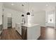 Bright, open-concept kitchen with a large island, stainless steel appliances, and hardwood floors at 2150 Tidwell Ln # 5, Atlanta, GA 30318