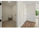 Hallway with view into laundry room with a sink, and door to a closet at 2150 Tidwell Ln # 5, Atlanta, GA 30318