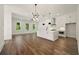 Open living space with modern lighting, wood floors, and bright windows showcasing outdoor views at 2150 Tidwell Ln # 5, Atlanta, GA 30318