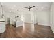 Bright and open living room featuring wood floors, white walls, and a modern ceiling fan at 2150 Tidwell Ln # 5, Atlanta, GA 30318