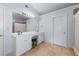 Bathroom showcasing double sinks, a large mirror, vanity space, and tiled floors at 3134 Milloak Ct, Buford, GA 30519