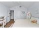 Bright bedroom with wood floors, ceiling fan, light, neutral walls, and a large window at 3134 Milloak Ct, Buford, GA 30519