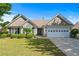 Charming single-story home with well-manicured lawn and lush landscaping under a clear blue sky at 3134 Milloak Ct, Buford, GA 30519