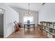 Stylish home office featuring ample workspace, modern lighting, and bookshelves for organized productivity at 3134 Milloak Ct, Buford, GA 30519