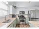 Bright kitchen featuring stainless steel appliances, granite countertops, ample storage and an undermount sink at 3134 Milloak Ct, Buford, GA 30519