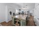 Spacious kitchen featuring a large granite island, modern appliances, and ample cabinet space at 3134 Milloak Ct, Buford, GA 30519