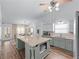 Open floor plan featuring a kitchen island with view to dining area and stainless steel appliances at 3134 Milloak Ct, Buford, GA 30519