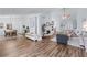Open-concept living space with dining area, wood flooring, fireplace, and ample room for entertaining at 3134 Milloak Ct, Buford, GA 30519