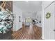 Inviting entryway leading into a spacious living room with wood floors and recessed lighting at 3134 Milloak Ct, Buford, GA 30519
