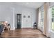 Inviting living room with natural light, wood floors, large windows, and plenty of space for relaxation at 3134 Milloak Ct, Buford, GA 30519