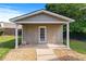 Exterior of backyard outbuilding with covered porch and gravel surround at 3134 Milloak Ct, Buford, GA 30519