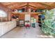 Interior of outbuilding showing storage space, workspace, and natural light at 3134 Milloak Ct, Buford, GA 30519