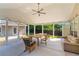 The covered patio offers a ceiling fan, string lights, plus a comfortable seating and dining area at 3134 Milloak Ct, Buford, GA 30519