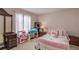 Charming bedroom featuring a comfortable bed, ample natural light, and toys for Gathering enjoyment at 3739 Lake Carlton Rd, Loganville, GA 30052