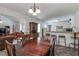 Bright dining room adjacent to the kitchen, featuring a chandelier and access to the living room at 3739 Lake Carlton Rd, Loganville, GA 30052