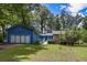 Charming single-story home with a large front yard and an attached two-car garage at 3739 Lake Carlton Rd, Loganville, GA 30052