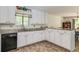 Bright and functional kitchen with ample cabinet space and granite countertops at 3739 Lake Carlton Rd, Loganville, GA 30052