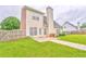 Spacious backyard featuring a well-maintained lawn, patio, and fenced perimeter at 1016 E Bay Springs Dr, Villa Rica, GA 30180