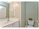 Clean and functional half bathroom with single sink vanity and toilet at 1016 E Bay Springs Dr, Villa Rica, GA 30180