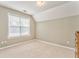 Cozy bedroom with natural light from a large window and neutral walls at 1016 E Bay Springs Dr, Villa Rica, GA 30180