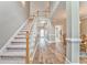 Inviting foyer boasts wood floors, high ceilings, staircase, and flows into dining and living areas at 1016 E Bay Springs Dr, Villa Rica, GA 30180