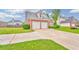 Lovely home with a two-car garage, green lawn, and traditional brick facade in a suburban setting at 1016 E Bay Springs Dr, Villa Rica, GA 30180